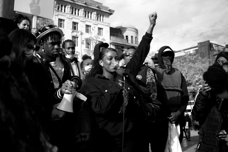 several people and a microphone with one person up in the air