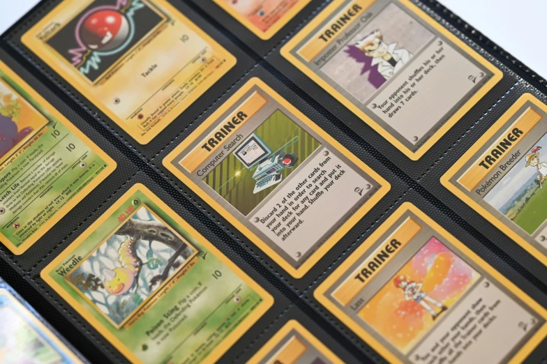 several different pokemon trading cards are arranged on the table