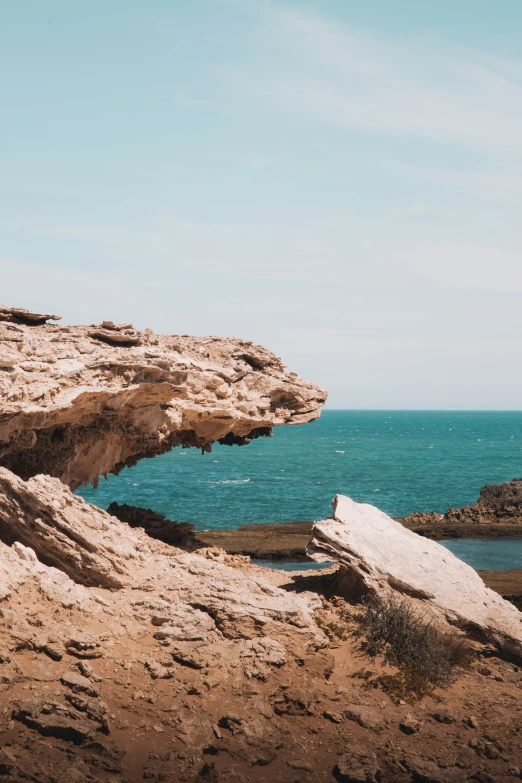 an image of a rock formations on the shore