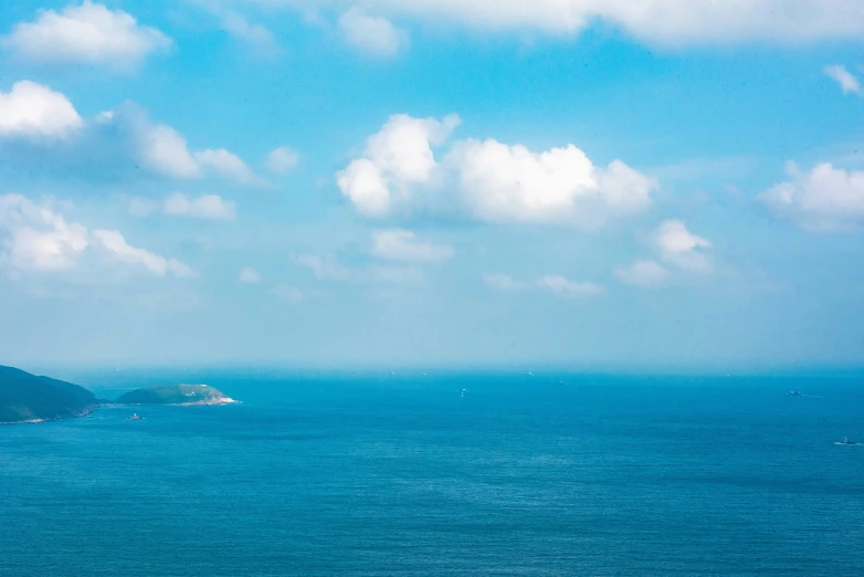 the ocean with some boats out in the water