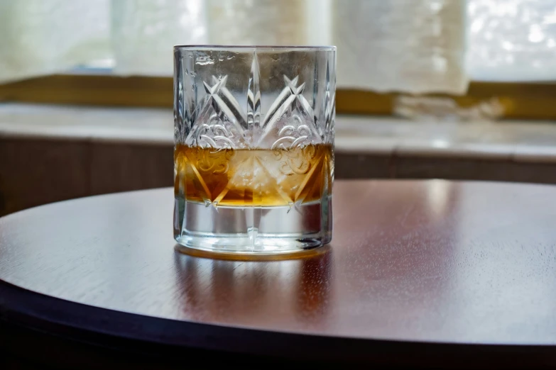 a glass with a white substance in it on top of a table