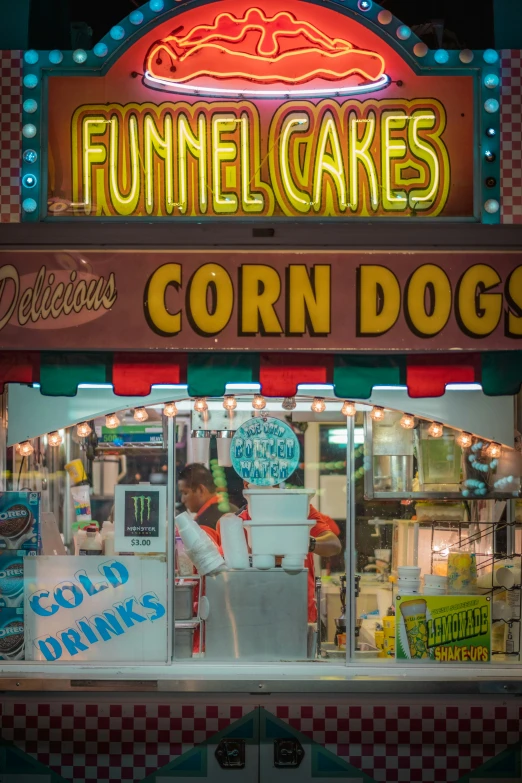 a restaurant with a neon sign above the front