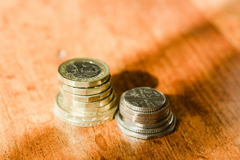 three different stacks of coins next to each other