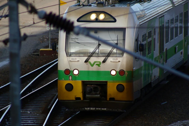 a passenger train in motion down the tracks