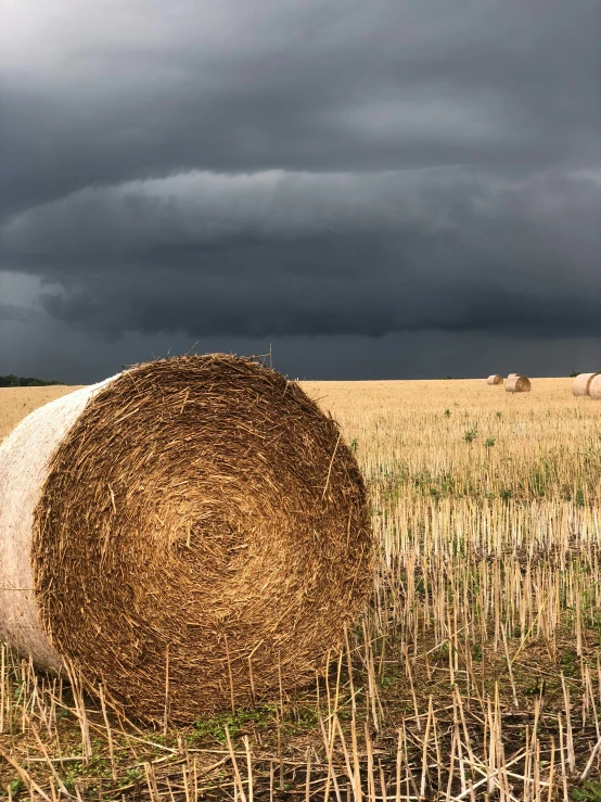 a big hay bale on the side of the road