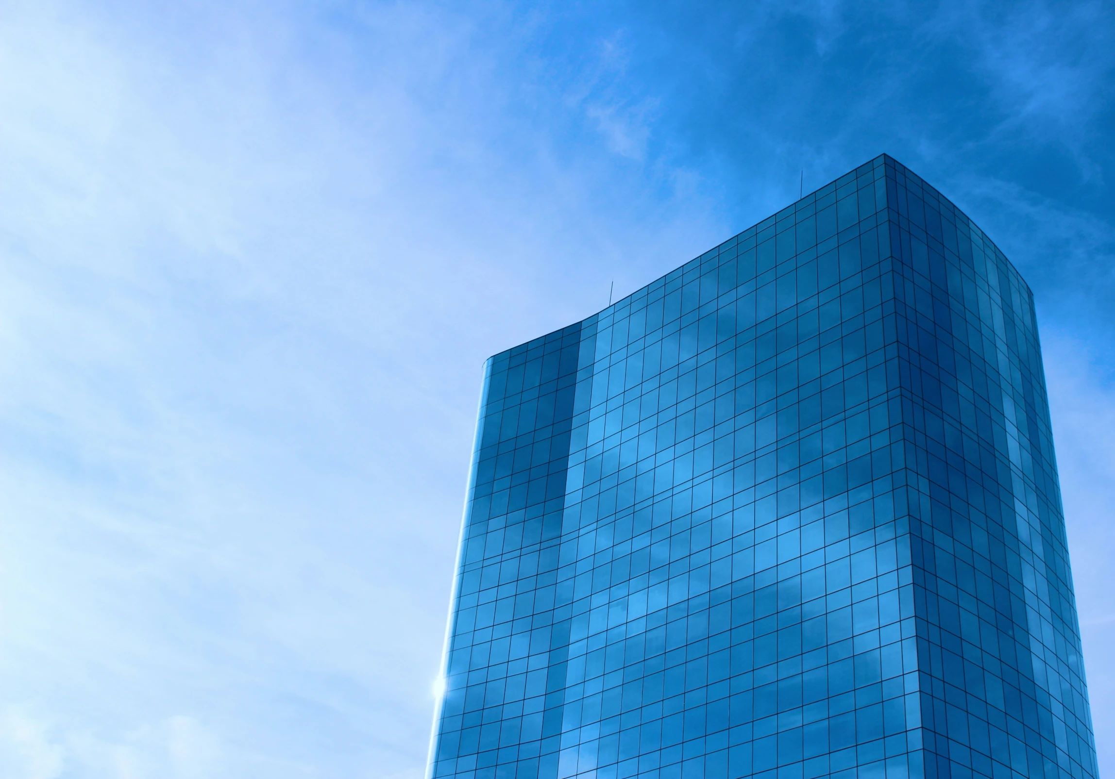 a very tall building with a sky background