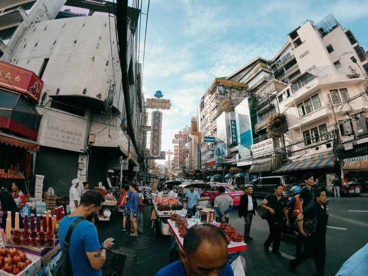 an asian city street has a bunch of traffic