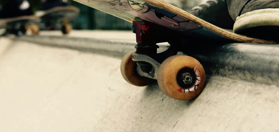 the top half of a skateboard with the wheels off