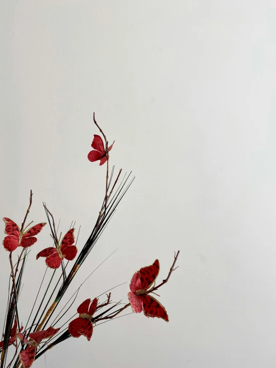 a simple arrangement with twigs and flowers in a vase
