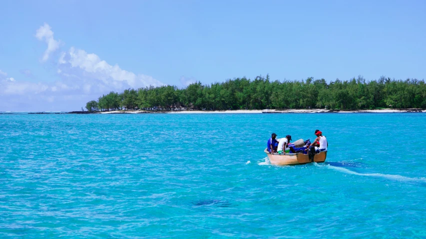 a row boat with people in it on the water