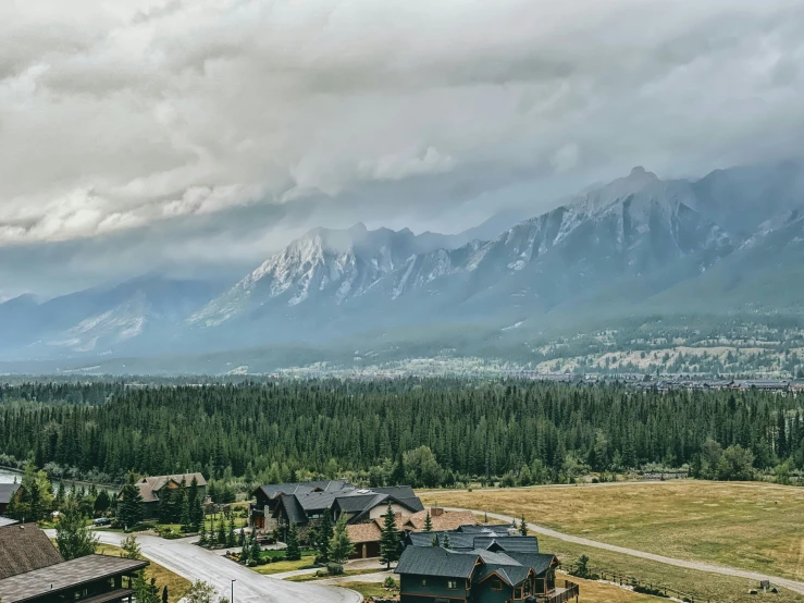 a scenic landscape with a mountain range in the distance