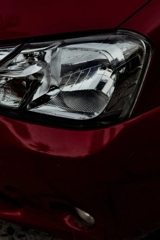 closeup of the headlight and grill on a vehicle