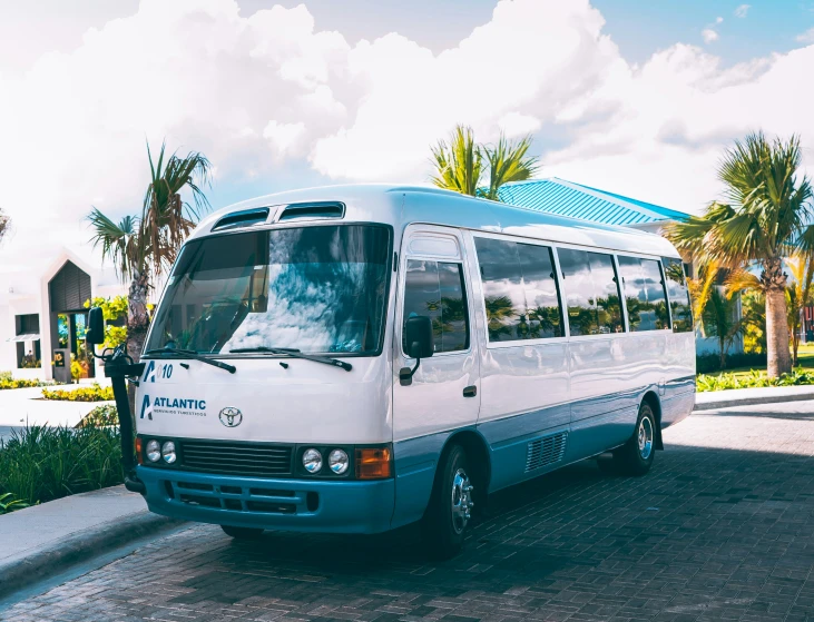 a bus parked in the road outside near trees