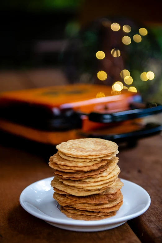 a stack of pancakes sits on a white plate