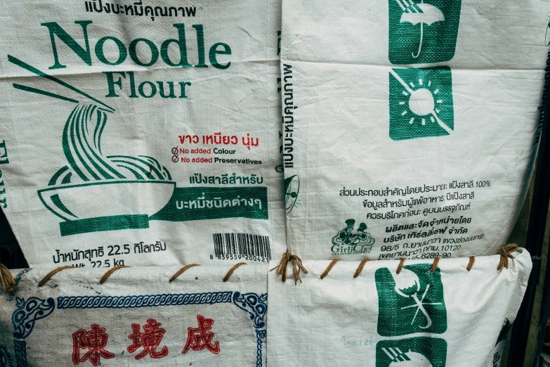two packages of noodles sitting on a table