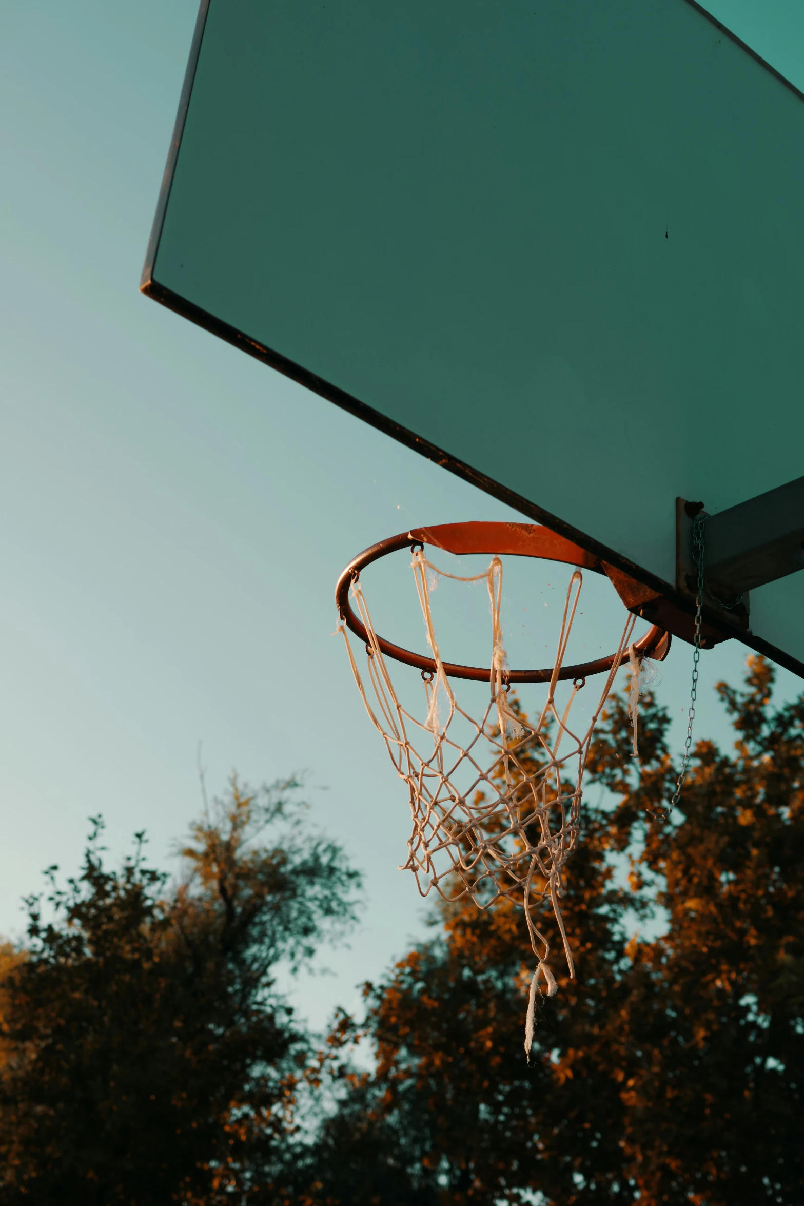 a basketball going into the basket during a game