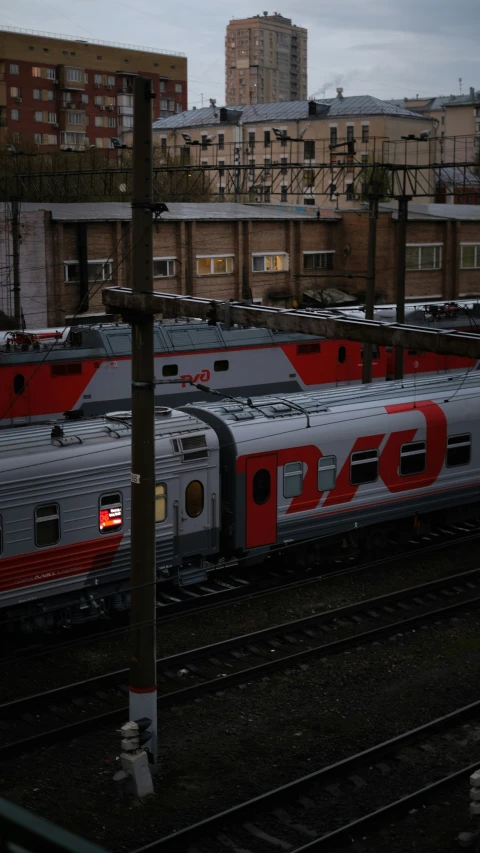 the trains are all lined up in a train station