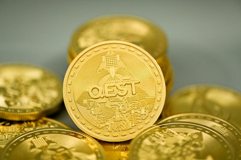 a stack of golden coins on a table
