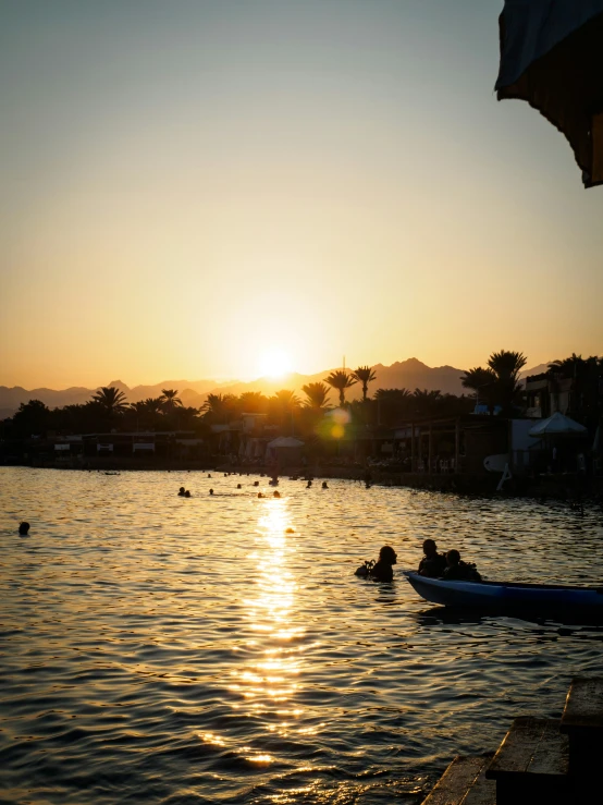 a body of water with several people floating in it