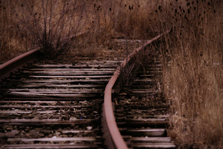 a rusty railroad track that has been run down