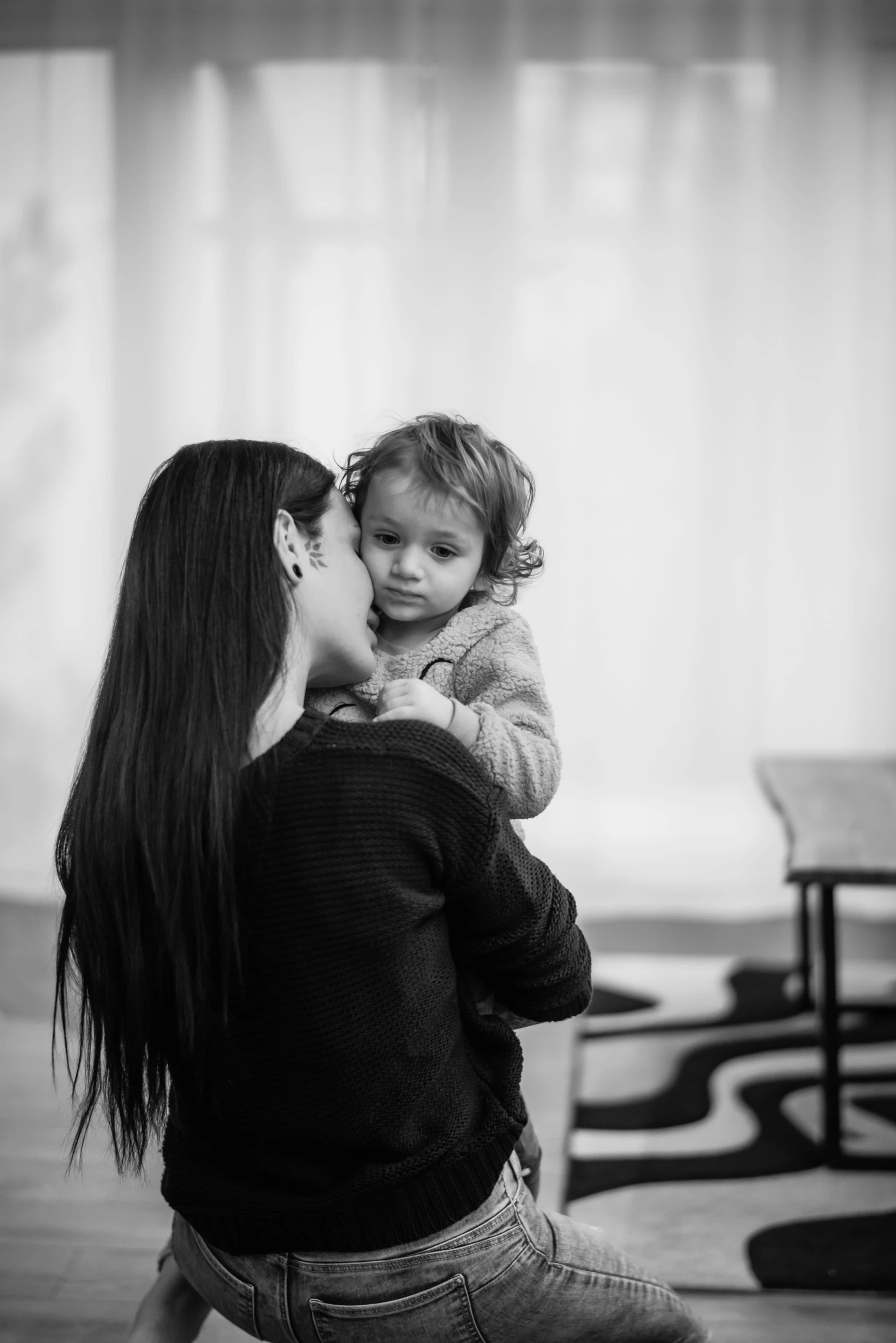 black and white pograph of a woman with her baby