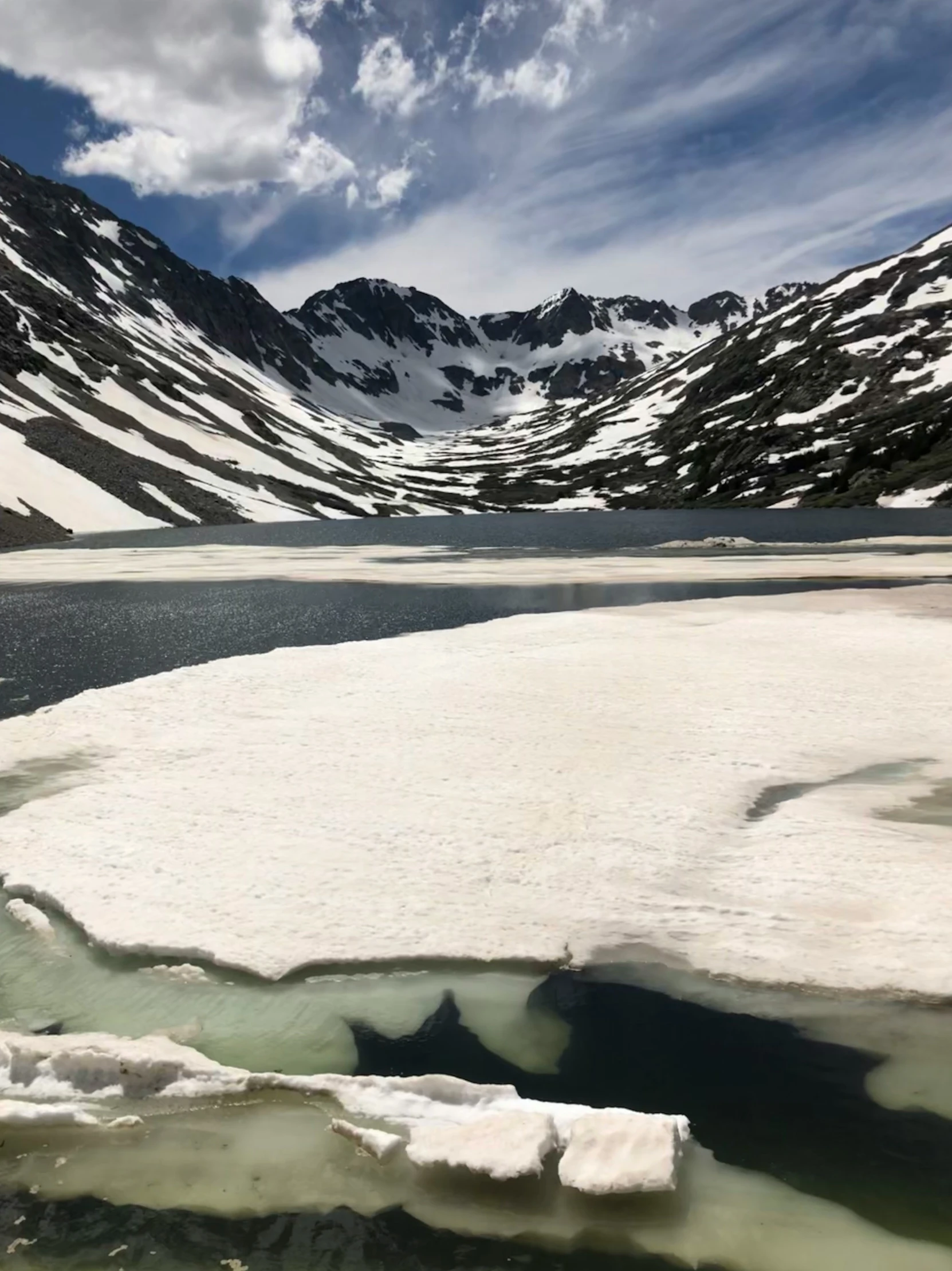 an icy river that is in the mountains