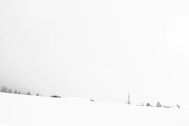 a group of people riding skis on a snow covered slope