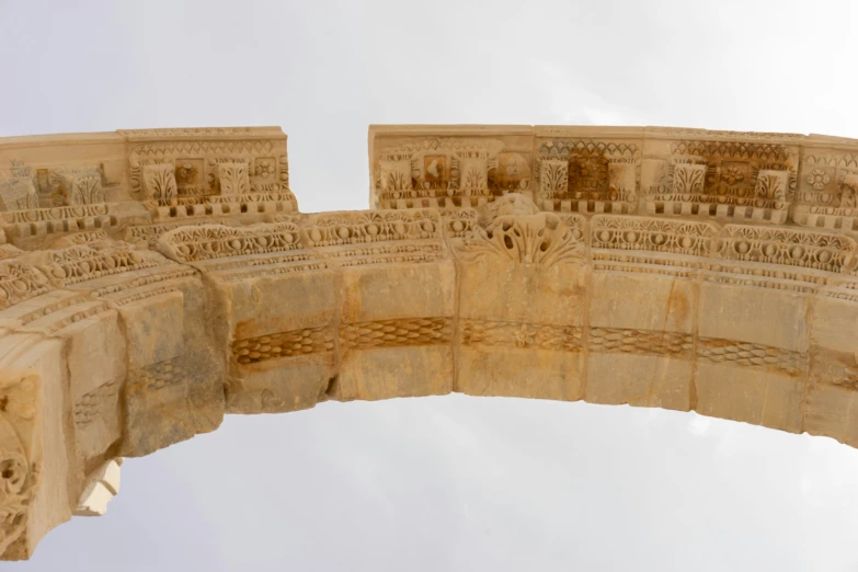 a roman building with a clock on the top