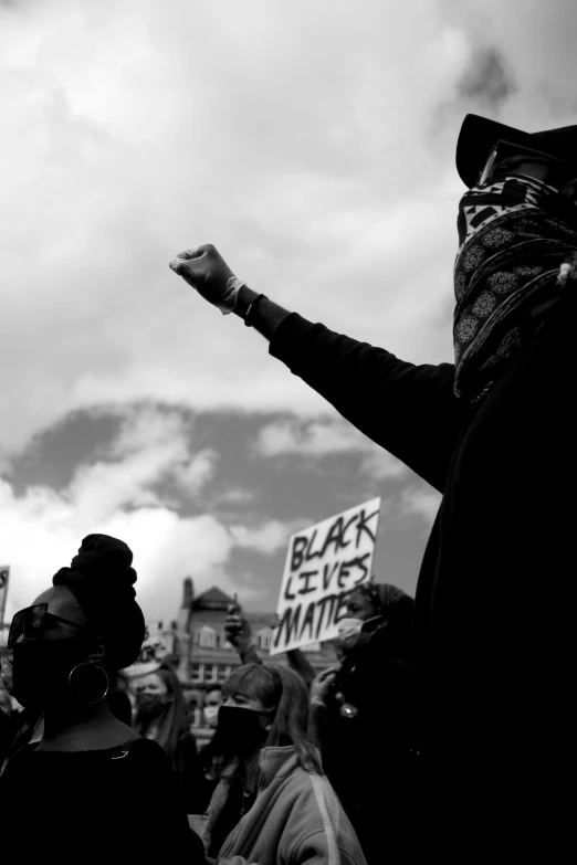 a man who is holding a sign with his hand