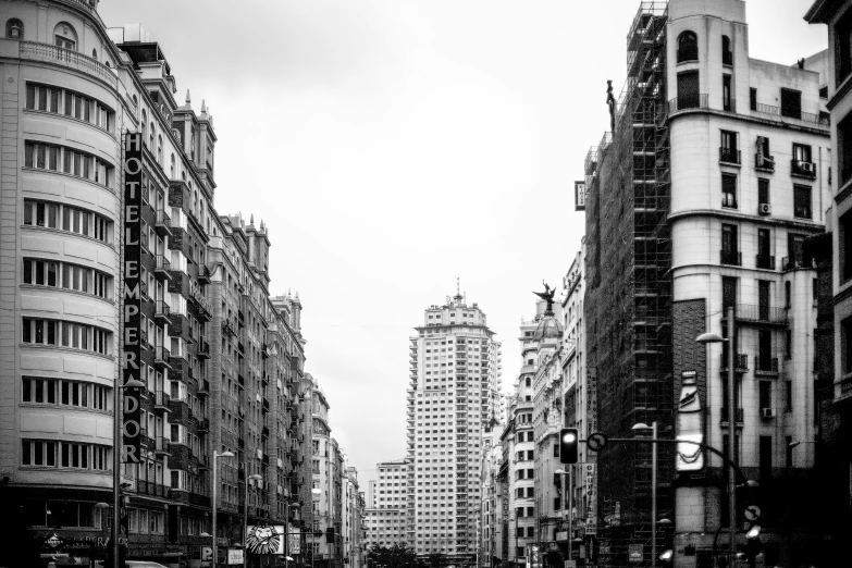 a black and white po of skyscrs with dark clouds