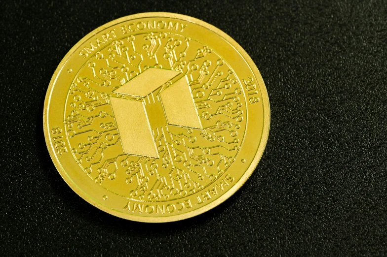 gold coin with the letter f on the front