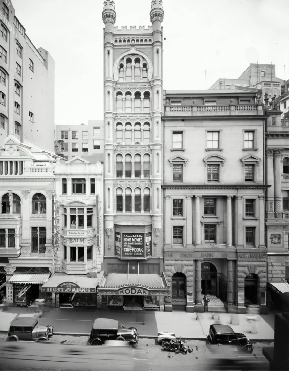 an old building that is in the middle of two big buildings