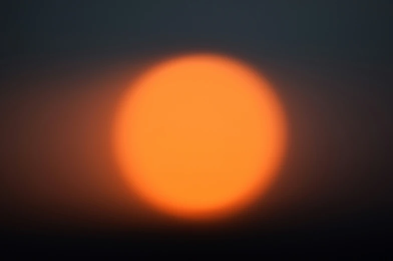 a partial view of a sun in the sky