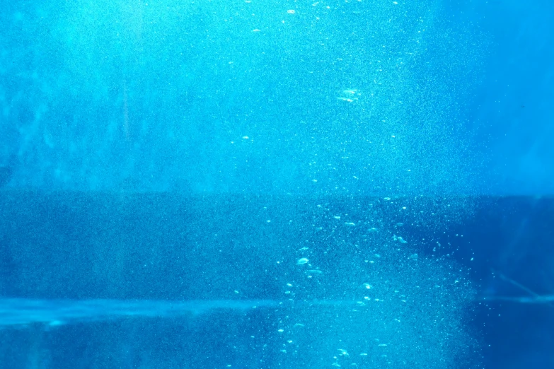 a blue water texture or background with bubbles