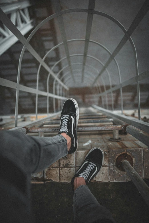 a pair of black and white shoes in an indoor structure