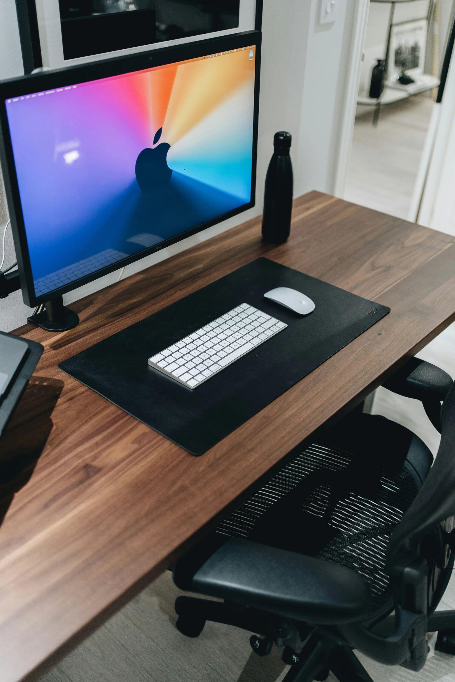 a computer monitor on top of a desk