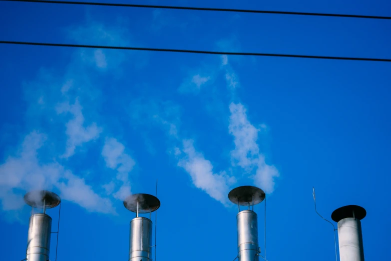 smoke stack in the distance from power lines