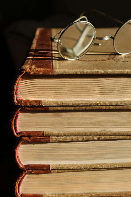 a close up of the book and two glasses on top