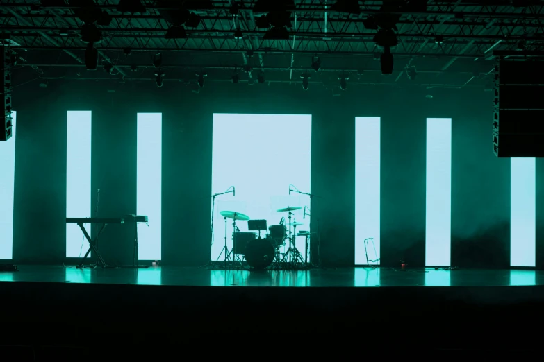 an empty stage with lights and a band on it