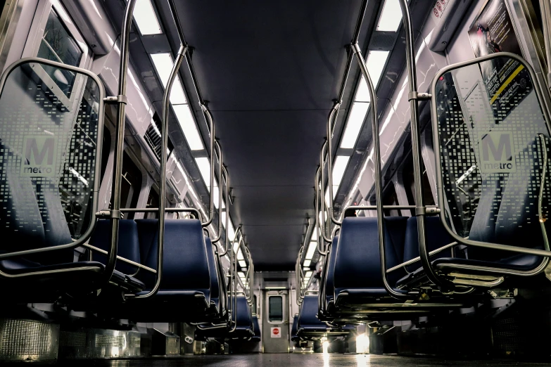 two buses that are parked inside a building