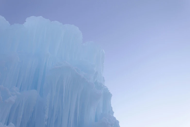 an ice climbing climb in front of some very high ice formations