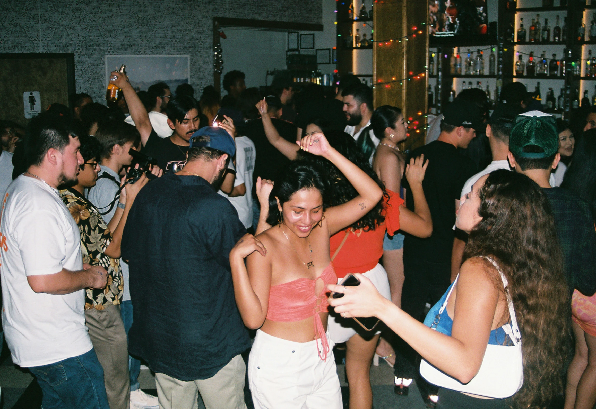 many people are dancing at a party