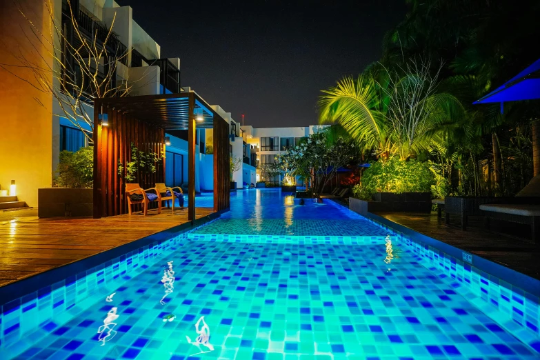 the el pool at night with lights reflecting in the water