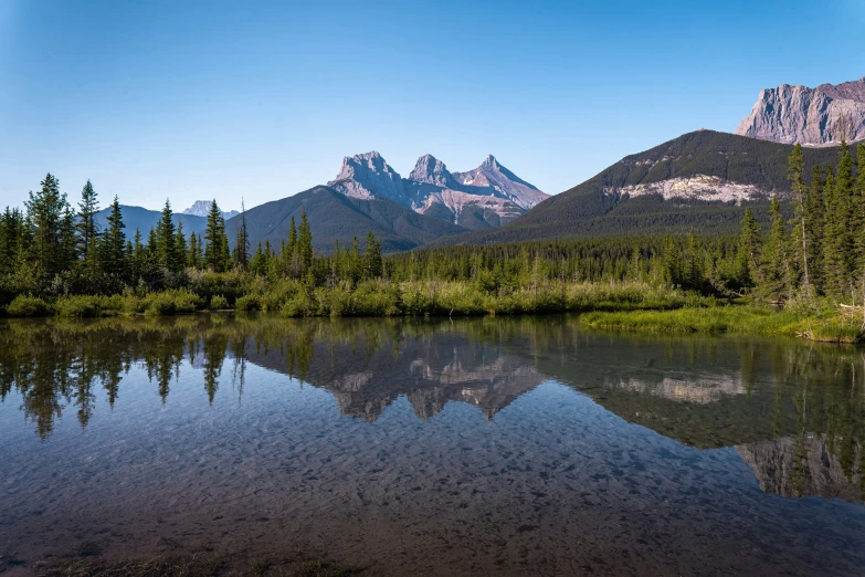 this is an image of a mountain range that can be seen from the river