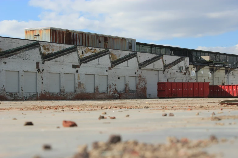 an abandoned industrial building with multiple large doors