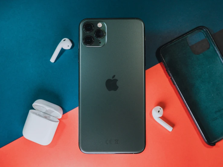 a black apple iphone with ear buds and an iphone