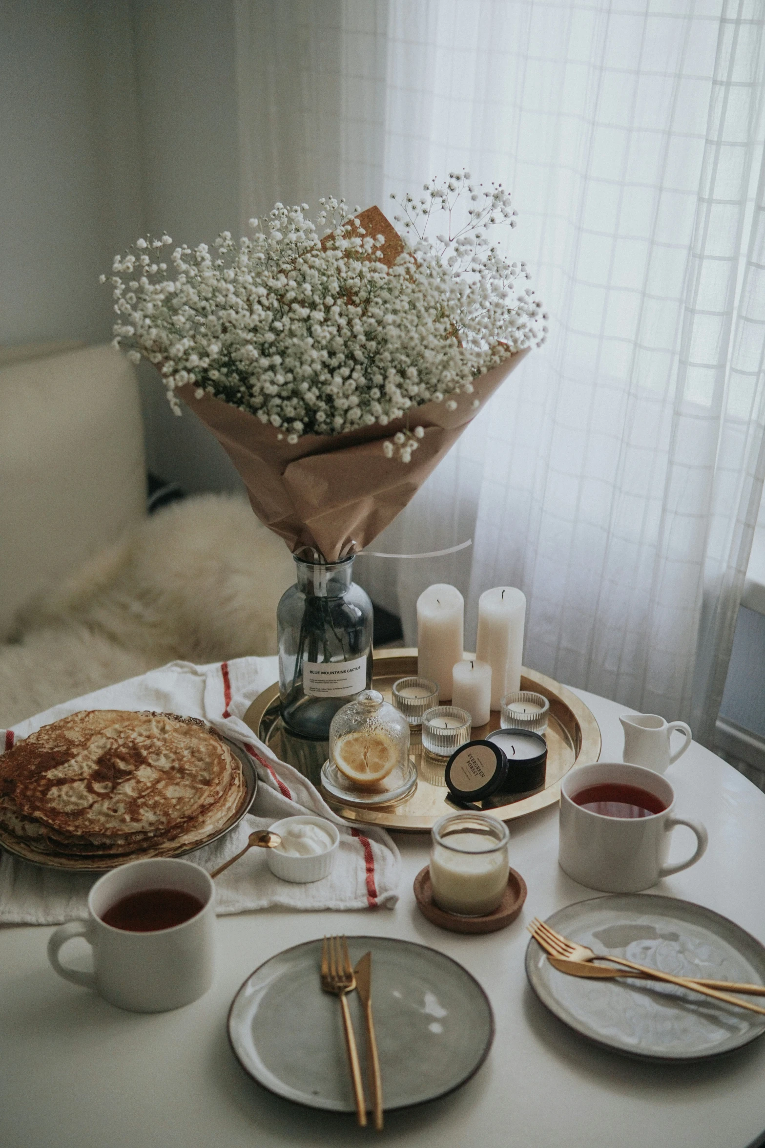 there is a table with an arrangement of food and drinks