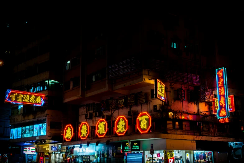 an oriental street with neon lights on it