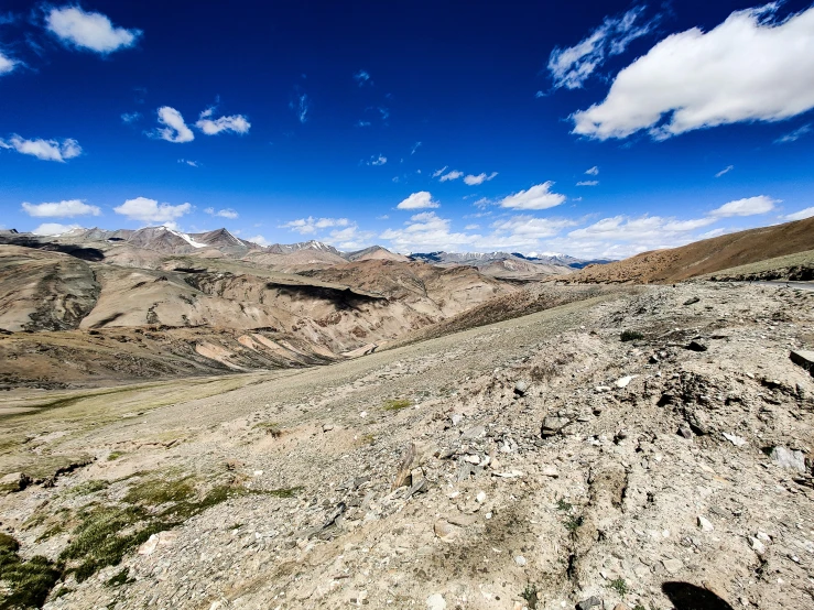 the top of a large mountain overlooking a body of water