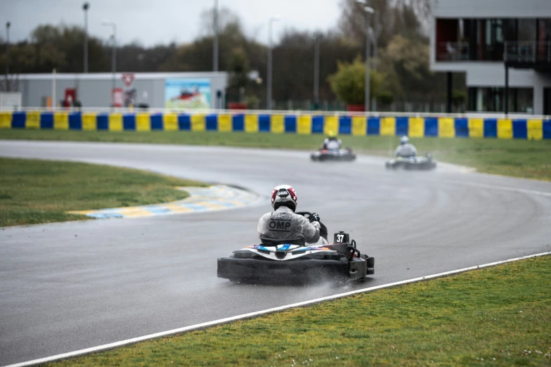 two speed cars are speeding down the racetrack